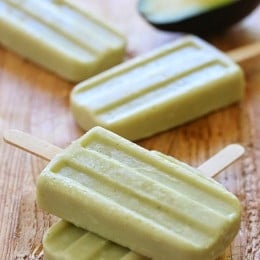 These creamy avocado coconut popsicles are made with just 4 ingredients – nutrient dense avocados, coconut-almond milk, raw sugar and coconut flakes.