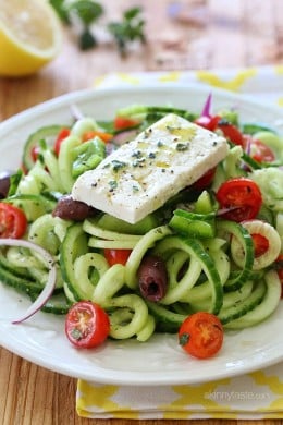 Spiralized Greek Cucumber Salad with Lemon and Feta is delicious, the perfect light dish. In Greece, Greek salads do not have lettuce, instead they are made with fresh cucumber, tomatoes, bell pepper, olives, red onion, oregano, lemon juice, olive oil, and fresh feta – delicious!