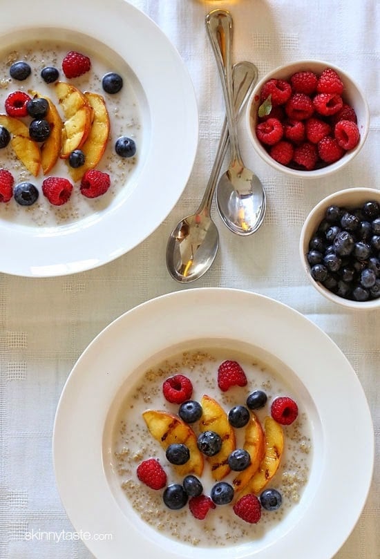 These Summer Quinoa Breakfast Bowls are my favorite! Served as a warm cereal topped with fresh fruit and a drizzle of honey. A healthy protein packed breakfast.