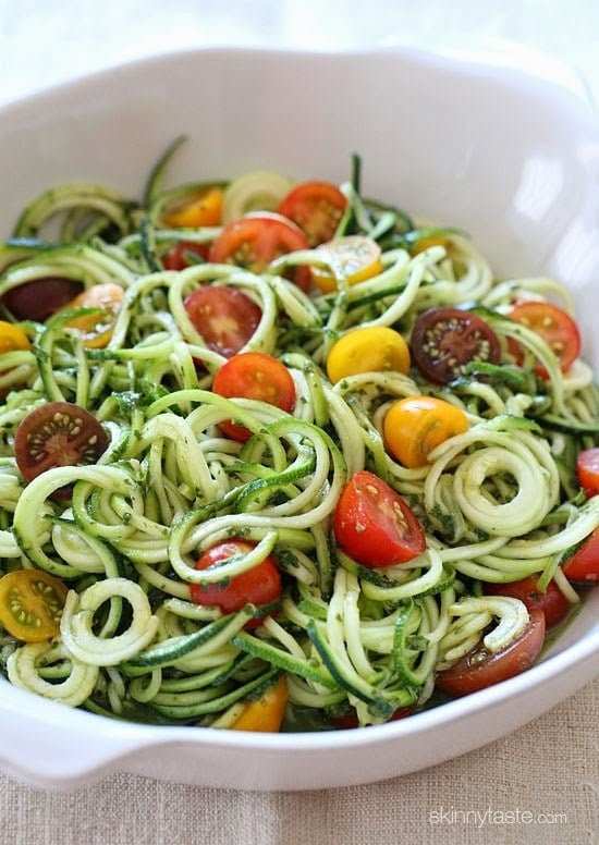 Raw Spiralized Zucchini Noodles with Tomatoes and Pesto is my favorite easy, end-of-summer vegetarian dish made with raw, garden vegetables and homemade pesto.