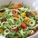 Raw Spiralized Zucchini Noodles with Tomatoes and Pesto is my favorite easy, end-of-summer vegetarian dish made with raw, garden vegetables and homemade pesto.