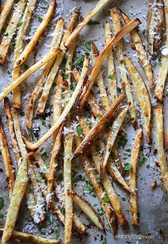 These delicious fries are baked in the oven with garlic, a little olive oil, kosher salt and black pepper, then sprinkled with freshly grated Parmesan and parsley – to die for!
