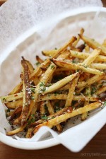 These delicious fries are baked in the oven with garlic, a little olive oil, kosher salt and black pepper, then sprinkled with freshly grated Parmesan and parsley – to die for!