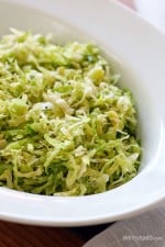 This raw shredded brussels sprouts salad is so simple to make, even a 4 year old can do it (with Mommy's help). Tossed with a little olive oil, lemon juice, salt and pepper, it makes a wonderful side dish to any meal, and my family loves it!