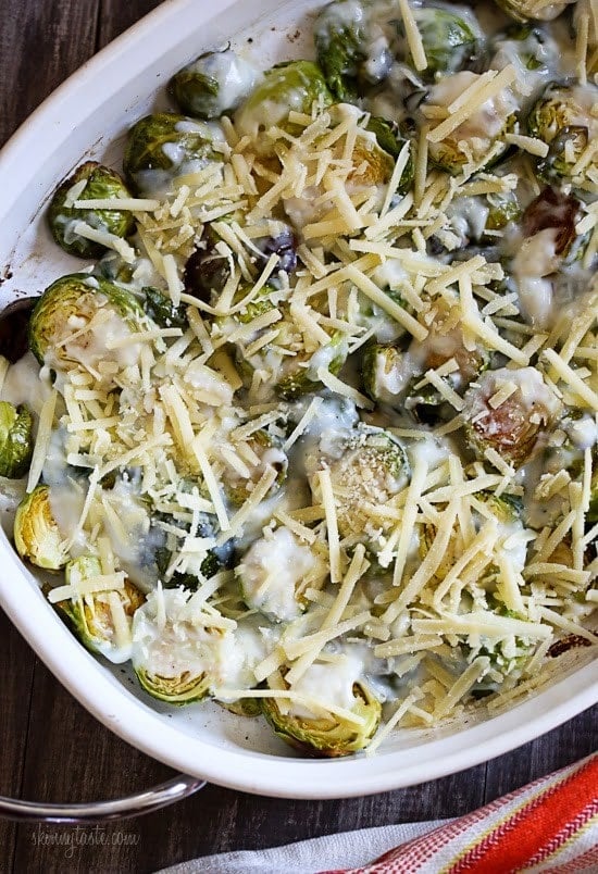 Brussels Sprouts Gratin are the perfect Holiday side dish! The brussels sprouts are roasted until crisp, then topped with a light cheese sauce made with Gruyere and parmesan, and baked until brown and bubbling. If you are as obsessed with brussels sprouts as I am, you'll love these.