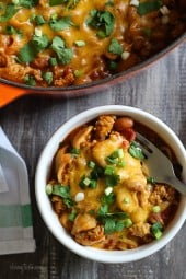 One Pot Cheesy Turkey Taco Chili Mac recipe is so easy and protein packed! Made with taco seasoning, beans, and pasta shells topped with cheese is a favorite in my home! Bonus points for dirtying only one pot!
