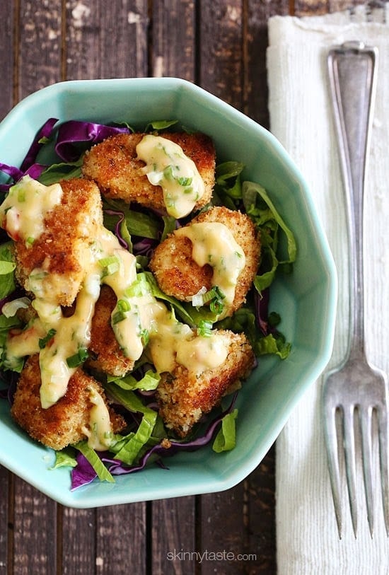 Bangin Good Chicken Salad is delicious, made with tender chunks of breaded chicken baked until golden topped with delicious Bang Bang sauce. I served this over mixed greens and swooned with every bite!