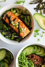 These Asian Salmon Bowls are my new addiction!! Served over brown rice and topped with cucumbers, avocado and sprouts and drizzled with a soy-wasabi vinaigrette – SO good!