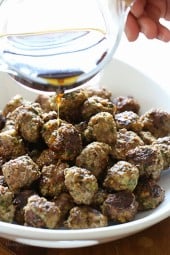 These mini meatballs, made with a combo of lean ground beef and spicy turkey sausage are browned in a skillet (or you can bake them) then finish cooking in the slow cooker. After they are cooked, you pour a delicious honey-lime sauce over them and watch them disappear!