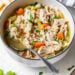 Chicken Barley Soup in a bowl with spoon.
