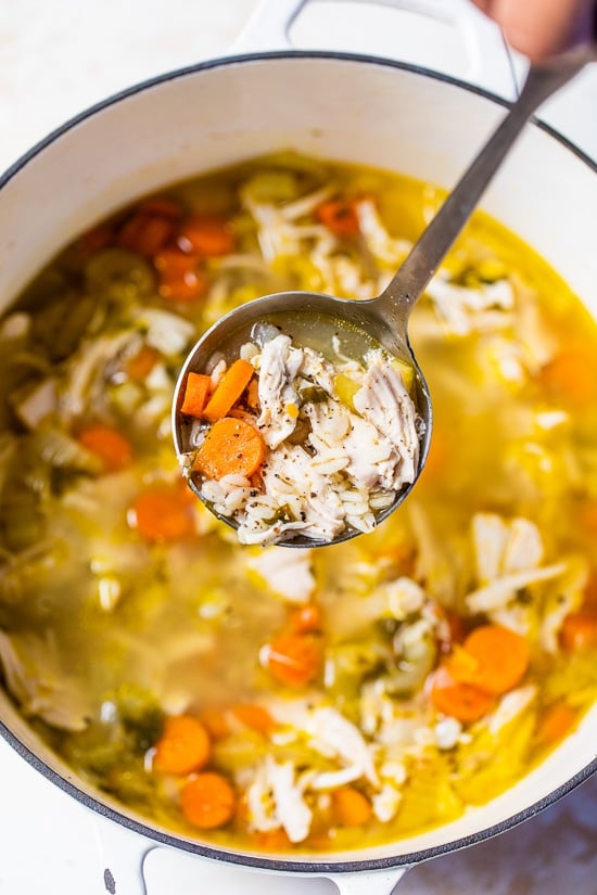 Chicken Barley Soup in a pot with ladle.