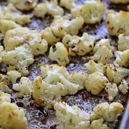 Roasting cauliflower brings out its nuttiness flavor and caramelizes the edges. This is such an easy way to prepare it, I toss it with garlic, lemon juice and olive oil and top it with freshly grated Parmesan cheese and some lemon zest when it comes out of the oven.