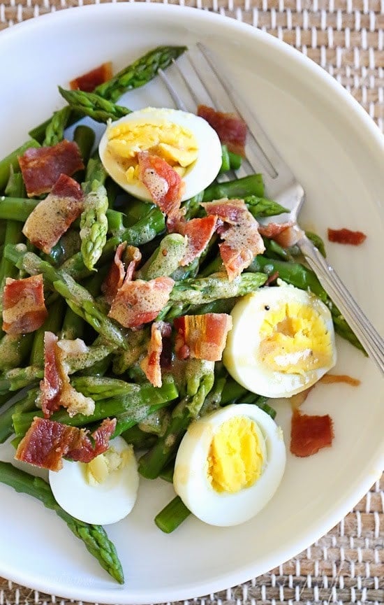 Asparagus Egg and Bacon Salad with Dijon Vinaigrette is the perfect easy Spring salad made with just a few simple ingredients – asparagus, hard boiled egg and bacon tossed with a Dijon vinaigrette.