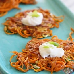 5-ingredient Sweet Potato Latkes – a healthier take on the traditional deep fried potato pancakes, these are lightly pan fried in a small amount of olive oil, made with sweet potatoes instead of white and made EASY by using a spiralizer because it eliminates the need to grate the potatoes, which can take a lot of time.