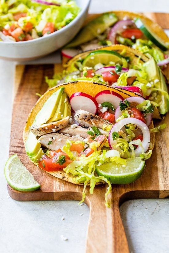 Grilled Chicken Tacos with Lettuce Salad, Avocado and Cotija