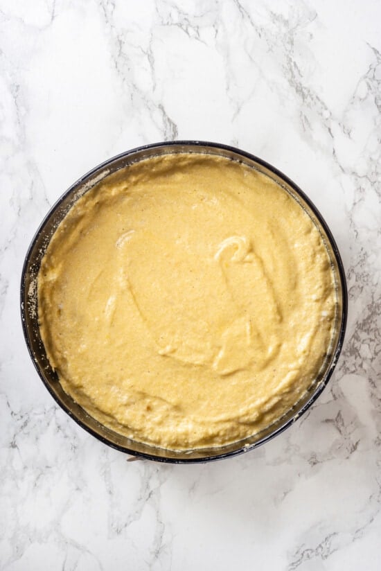 Overhead view of almond cake batter in pan