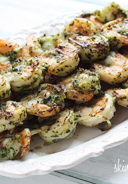 These easy Grilled Pesto Shrimp Skewers are made with homemade basil pesto, you'll want to make them all summer long!