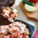 Skinny Shrimp Salsa is so good, you might not want to share! Made with shrimp, tomatoes, cilantro, red onion and lime juice. Bring this to a party and watch it disappear!