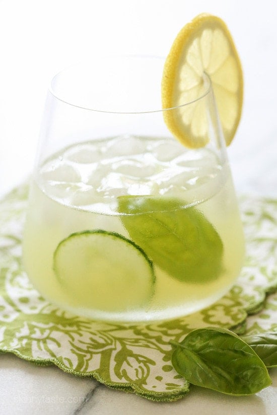 With the holiday weekend coming, if you're looking for a signature cocktail that looks like it jumped right off a spa cuisine menu for under 140 calories, this is it! Made with muddled cucumbers, basil, lemon juice, gin and a splash of seltzer, it's light and summery and perfect to serve at your next party.