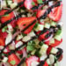 This easy light summer salad, made with cucumbers, strawberries, almonds and fresh herbs is great alongside grilled chicken, fish or for a light lunch you can double the serving and add some goat cheese to the mix or serve it over quinoa for more protein.