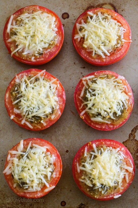 Pesto Parmesan Baked Tomatoes are delicious roasted tomatoes topped with pesto and shredded Parmesan cheese. So easy to make, only 3 ingredients!