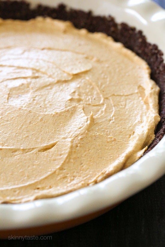 An EASY Fall dessert, this no-bake cheesecake is light and fluffy, made with pumpkin and spices. Quick and simple to make in under 10 minutes, if you use ready made crust.