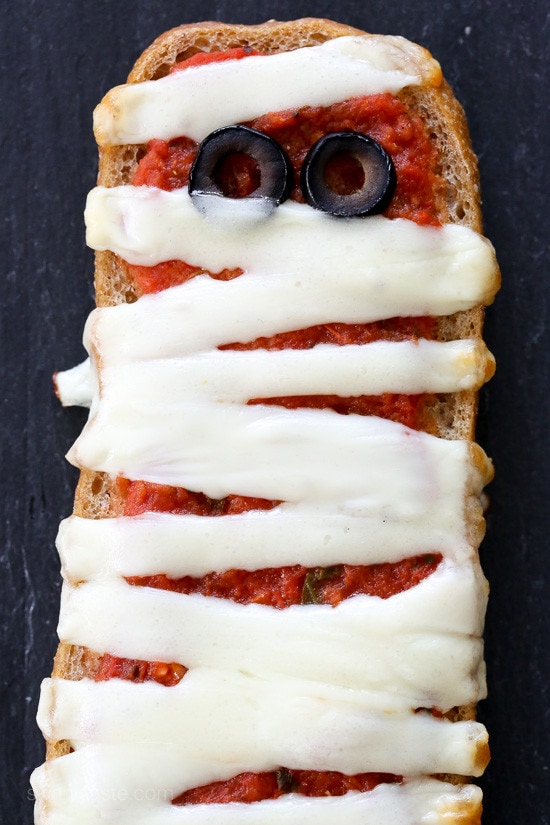 These EASY French bread pizzas are perfect for your next Halloween party, for kids or adults! Just 4 ingredients and about 15 minutes to make!