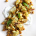 In an effort to still enjoy the flavors yet lighten things up a bit, I decided to create this roasted cauliflower and chickpea dish with minty yogurt. It’s great for lunch or as a side dish with dinner.
