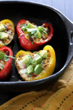 Bell peppers stuffed with my ever-so-popular Crock Pot Chicken Taco Chili and topped with cheese – easy and SO good!I love a recipe that can turn into several dishes to use throughout the month.