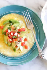 I'm pretty obsessed with making open-faced omelets and make them all the time topped with whatever I have on hand (you may remember this tomato and feta omelet). Since I always have avocados on hand, and I had some leftover pico de gallo from this recipe, I've been whipping this up all week!