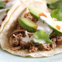 Delicious Mexican pork made in the Instant Pot (pressure cooker) for tacos, burrito bowls, taco salads and more (also great with cilantro lime rice)!