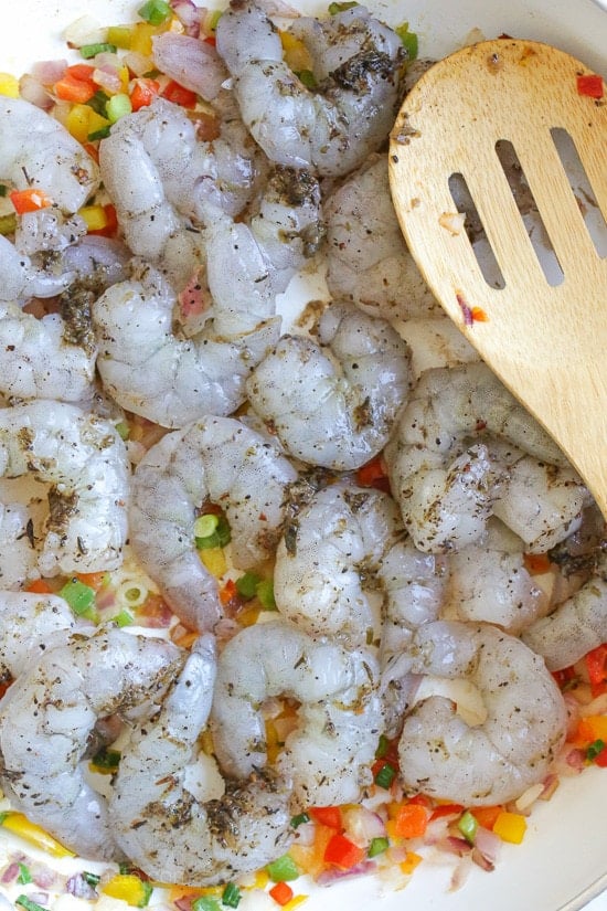 Quick Jamaican shrimp recipe. Raw shrimp in a skillet.