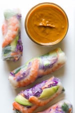 Love the colors in these FRESH homemade Vietnamese style shrimp summer rolls! Accompanied with a peanut hoisin dipping sauce. They are simple to make at home and can be filled with any type of protein and veggies you like.