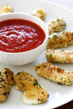Hot baked mozzarella sticks – I can't think of a more popular finger food for both kids and adults alike. My oldest daughter Karina LOVES them and these never disappoint! Made lighter with part-skim mozzarella then coated with crispy seasoned breadcrumbs and baked (not fried!) until hot and golden. Serve them with my quick marinara sauce and you have yourself an appetizer everyone will love!