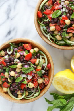 This Mediterranean Bean Salad is so light and fresh, made with lemon juice, mint and parsley. This can be served as a side dish, perfect for potlucks or to make it a main for lunch serve it over spiralized cucumbers.