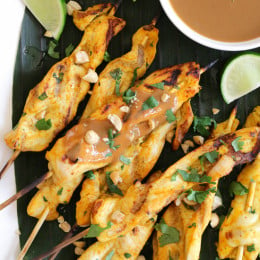 These easy, flavorful Thai inspired chicken skewers are marinated in coconut milk and spices, then grilled and served with a delicious spicy peanut sauce for dipping.