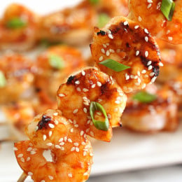 Sweet and spicy Korean-inspired Gochujang-Honey Glazed Shrimp Skewers are perfect for weeknight cooking because they take less than 10 minutes to cook.