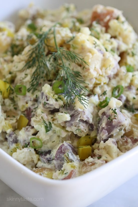 This creamy potato salad made with rainbow potatoes, celery, pickles, mustard and dill is lightened up using half mayonnaise, half yogurt. Perfect for picnics and backyard parties all summer long.