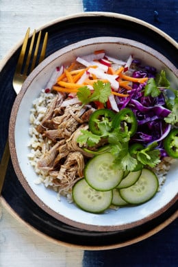 If you’ve ever had the classic Vietnamese Banh Mi sandwich, you probably know the bread can easily overpower the pork, pickled carrots and all the wonderful flavors, so I scrapped the bread and put all the goodies in a bowl over brown rice (it’s great over any grain) in my slim remake which is easy to make any night of the week!