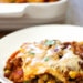 Late Summer Vegetable Enchilada Pie – A saucy, lasagna-like Mexican-American casserole layered with vegetables, tortillas, sauce and cheese.