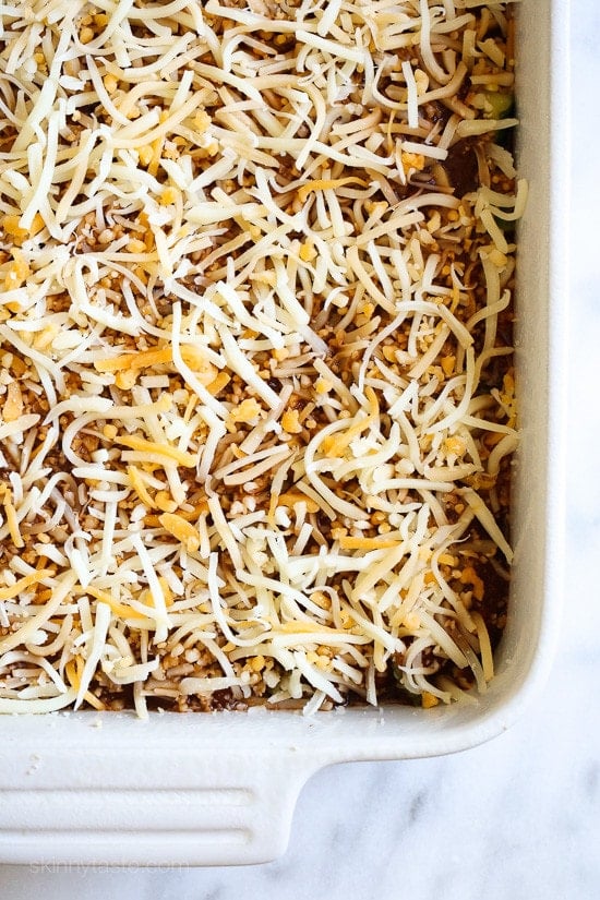 Assembling Late Summer Vegetable Enchilada Casserole