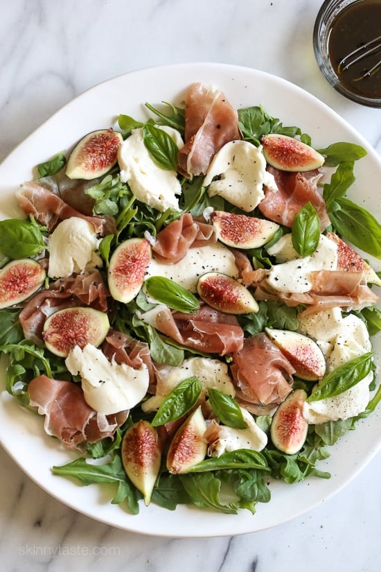 Figs and Prosciutto, savory and sweet they're a match made in heaven! Add some fresh mozzarella, peppery arugula and balsamic dressing and this salad will make you swoon with every bite.