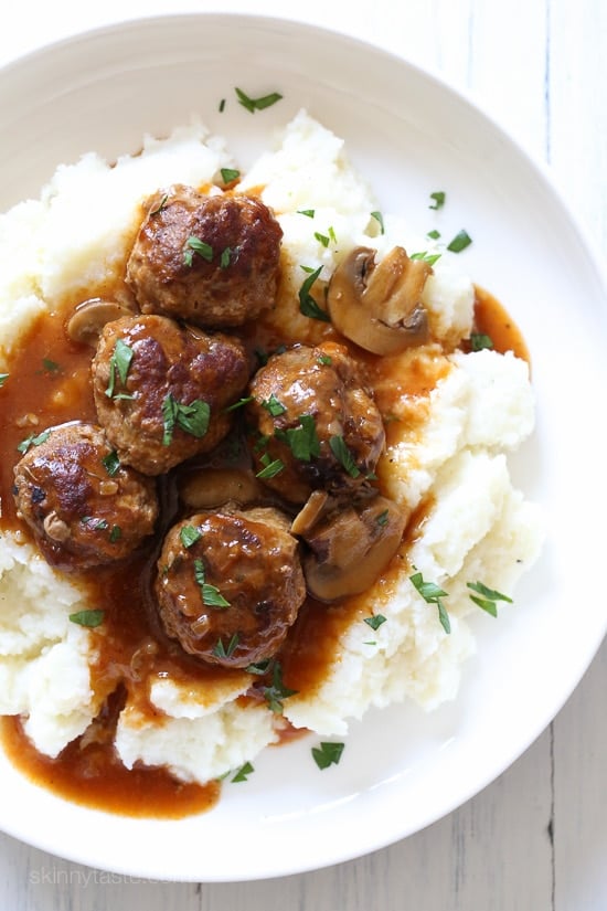 These beefy meatballs are cooked in a mushroom gravy and lightened up by using half ground turkey and half lean ground beef. Kid-friendly, comforting and delicious! Make them in the Instant Pot, Slow Cooker or Stove Top!