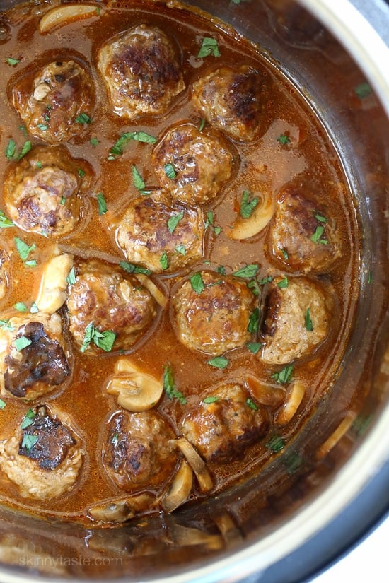 These beefy meatballs are cooked in a mushroom gravy and lightened up by using half ground turkey and half lean ground beef.