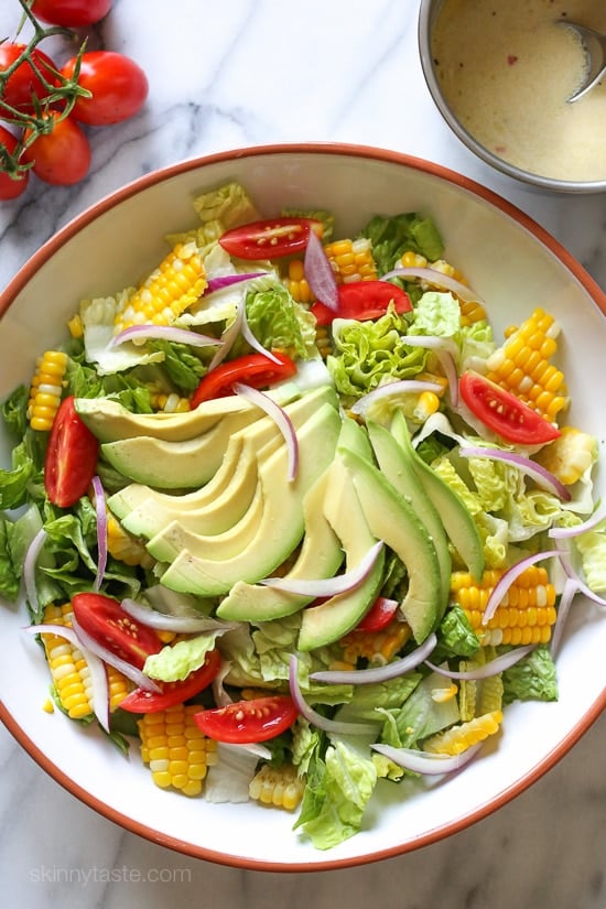 Summer Corn, Tomato and Avocado Salad are delicious topped with a Buttermilk-Dijon Dressing, goes great with anything you're grilling!