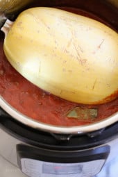 Make meat sauce AND Spaghetti Squash at the same time with this delicious one-pot meal ready in under thirty minutes (if using a pressure cooker)!