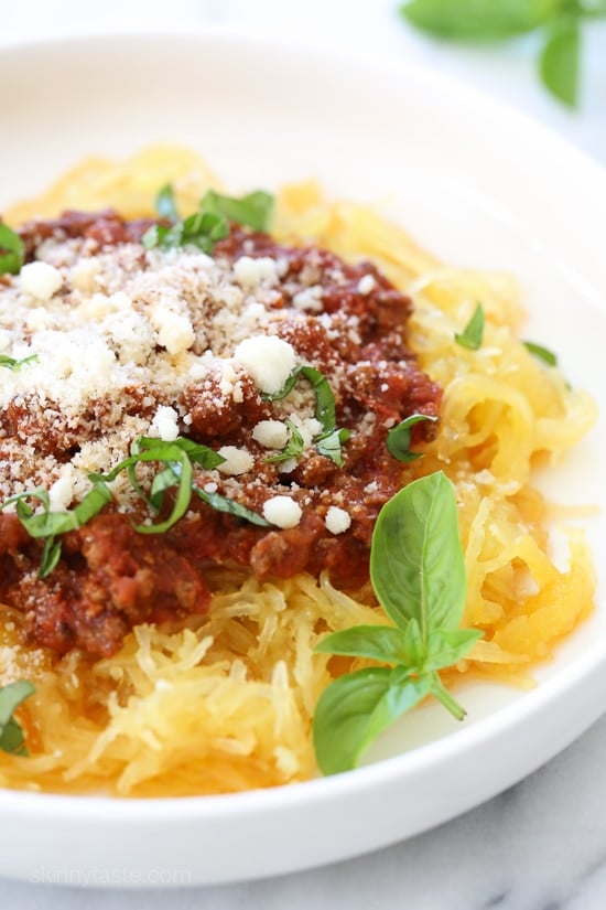 Make this easy, healthy Spaghetti Squash AND Meat Sauce all at the same time with this delicious one-pot meal ready in under thirty minutes when made in the pressure cooker or slow cooker! This is the easiest way to make spaghetti squash whole, no cutting before it's cooked, just poke some holes all over and cook it!
