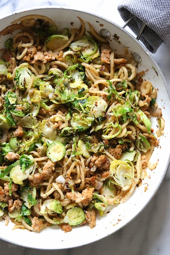 Spiralized parsnips make a wonderful pasta replacement in this spicy Autumn dish made with brussels sprouts and spicy chicken sausage.