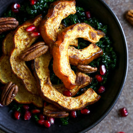 Roasted winter squash, pomegranates and pecans over massaged kale with a light maple balsamic dressing – there is nothing boring about this salad! Rubbing the raw kale with olive oil for a few minutes leaves it tender and takes away the bitterness.