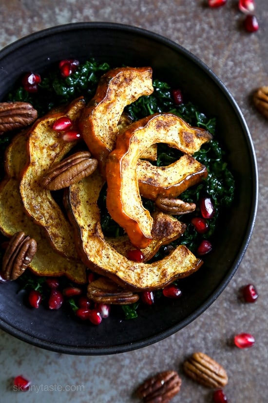 Roasted winter squash, pomegranates and pecans over massaged kale with a light maple balsamic dressing – there is nothing boring about this salad! Rubbing the raw kale with olive oil for a few minutes leaves it tender and takes away the bitterness.